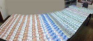 Large amount of cash foreign currencies, hidden inside the handbag, were disclosed